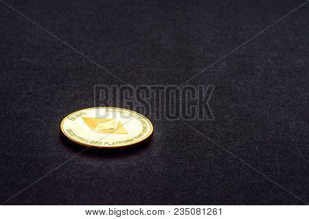 Golden Virtual Money Ethereum Crypto Currency Coin On A Dark Background.