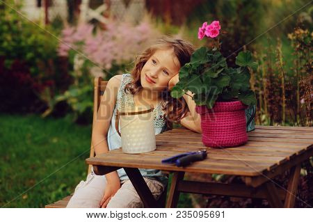Happy Romantic Child Girl Dreaming In Evening Summer Garden Decorated With Candle Holder.