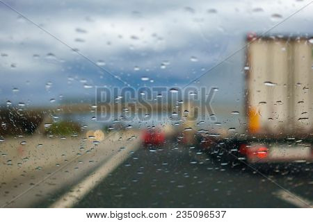 Driving In The Rain, Drivers View From Car, Out Of Focus, Highway