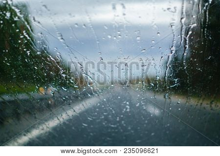 Driving In The Rain, Drivers View From Car, Out Of Focus, Highway