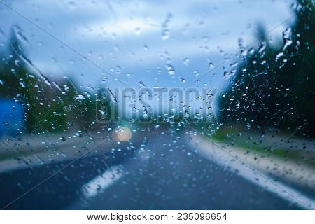 Driving In The Rain, Drivers View From Car, Out Of Focus, Highway