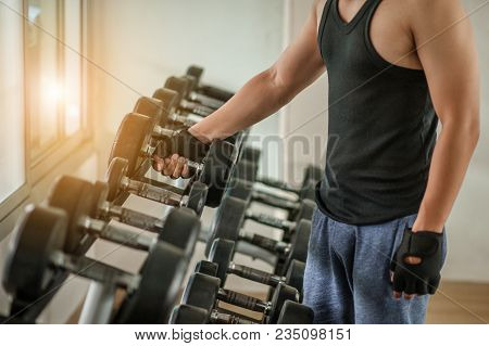 Rows Of Dumbbells In The Gym With Hign Contrast And Monochrome Color Tone.