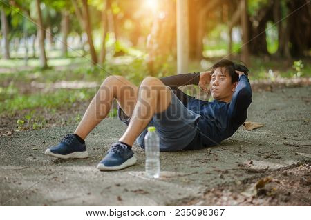 Sit Ups - Fitness Cross Fit Man Doing Sit-ups On Beach Training And Working Out With High Impact. Fi