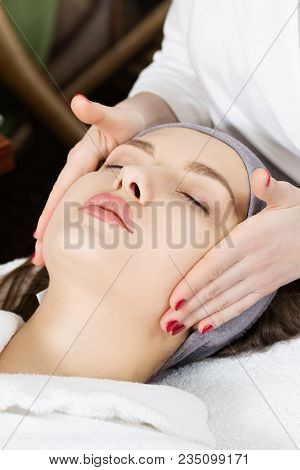 Facial Massage For A Beautiful Girl In A Spa Salon