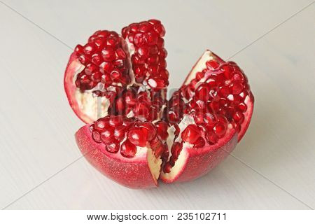 Big Ripe Red Granet Or Garnet. Fruits Of Red Ripe Pomegranate On The White Background. Vegetarian Co