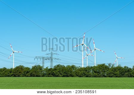 High Voltage Power Lines And Wind Turbines Seen In Rural Germany