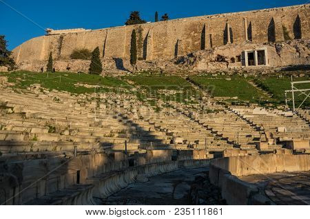 Athens,greece - December 27, 2017:  The Ruins Of Choragic Monument Of Thrasyllus And Theater Of Dion