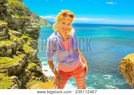 South Africa Holidays Concept. Happy Caucasian Woman At Cape Point Promontory, The Southeast Corner 