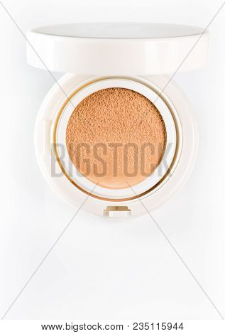 Foundation Cushion With A Tonal Base Pouring Out Of Puff On White Background