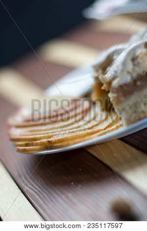 Square Shape Sliced Omemade Apple Pie With Kumquats And Almonds