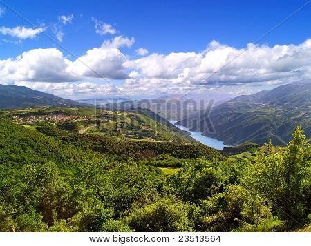 Hillsides, river and sky for background