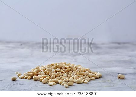 Pile Of Peelled Peanuts Isolated On White Textured Background, Background, Top View, Close-up, Selec
