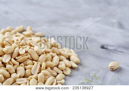 Pile Of Peelled Peanuts Isolated On White Textured Background, Background, Top View, Close-up, Selec