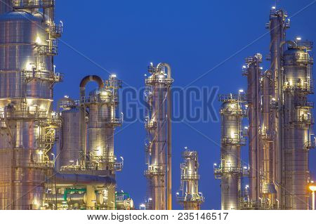 Chemical Industry Distillation Towers Detail At Night. Petrochemical Background.