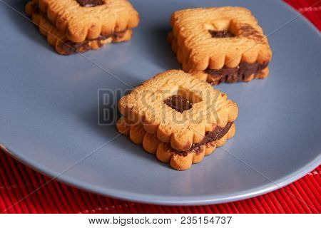 Stacked Chocolate Chip Cookies On Gray Style Plate