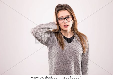 Portrait Of Happy Shocked Brunette Touching Her Head