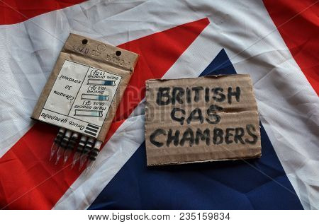 The scandal about poisoning of former Russian spy and killing his domestic pets cat and Guinean pigs. Animal abuse.Concept. British Flag background.April 7, 2018 in Kiev,Ukraine