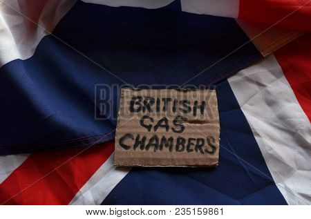 The scandal about poisoning of former Russian spy and killing his domestic pets cat and Guinean pigs. Animal abuse.Concept. British Flag background.April 7, 2018 in Kiev,Ukraine