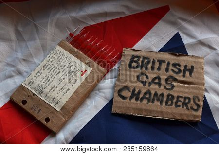 The scandal about poisoning of former Russian spy and killing his domestic pets cat and Guinean pigs. Animal abuse.Concept. British Flag background.April 7, 2018 in Kiev,Ukraine