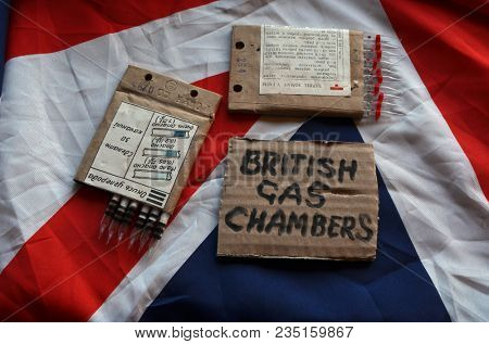 The scandal about poisoning of former Russian spy and killing his domestic pets cat and Guinean pigs. Animal abuse.Concept. British Flag background.April 7, 2018 in Kiev,Ukraine