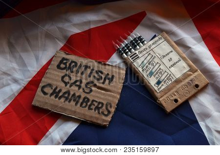 The scandal about poisoning of former Russian spy and killing his domestic pets cat and Guinean pigs. Animal abuse.Concept. British Flag background.April 7, 2018 in Kiev,Ukraine