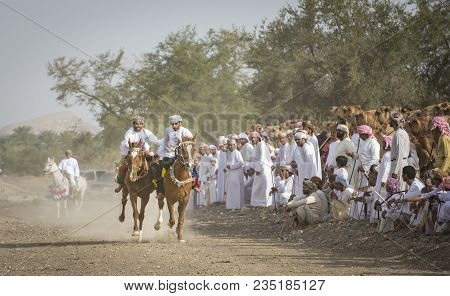 Ibri, Oman, April 7th, 2018: Omani Men Racing Horses In A Countryside Of Oman
