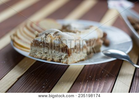 Square Shape Sliced Omemade Apple Pie With Kumquats And Almonds