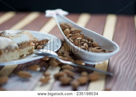 Square Shape Sliced Omemade Apple Pie With Kumquats And Almonds