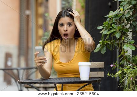 Attractive Latin Woman Shocked On Her Smart Phone