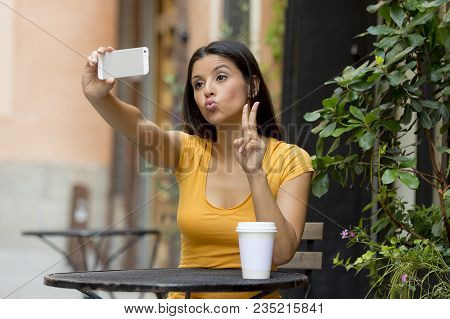 Attractive Brunet Latin Woman Smiling And Being Happy While Taking A Selfie On Holidays In Spain In 