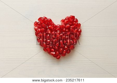 Red Heart Of Grenades. Big Ripe Red Granets Or Garnets. Fruits Of Red Ripe Pomegranate On The White 