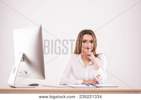 Beautiful Happy Businesswoman Using Computer While Sitting At The Desk At Office Isoltaed On The Whi