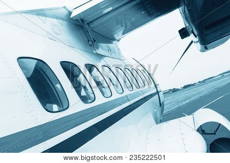 Turbolet Transport Aircraft For Parachute Jump, View Of The Airplane Windows