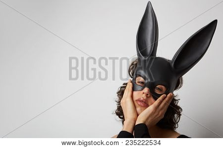 Sexy Beautiful Young Woman Posing In Lace Lingerie And Black Bunny Mask On White Background. Isolate