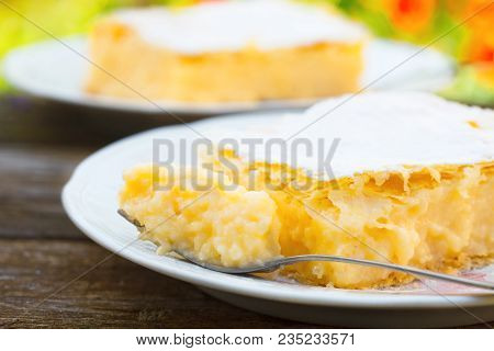 Homemade Cream Pie Made Of Two Layers Of Puff Pastry, Filled With Yellow Whipped Cream. Cremeschnitt