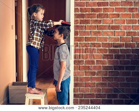 Sibings checking height