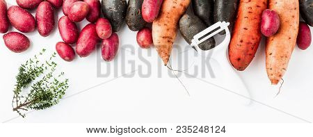 Different Varieties In Form And Color Of Potatoes  On A White Isolated Background. Red, Shetland Bla