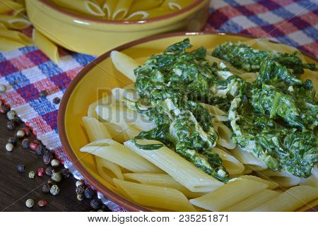 Homemade Cuisine Made With Pasta Covered With Spinac Creamy Sauce
