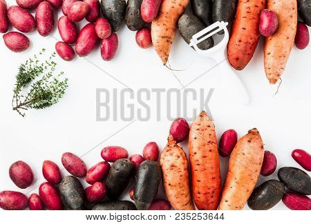 Different Varieties In Form And Color Of Potatoes  On A White Isolated Background. Red, Shetland Bla