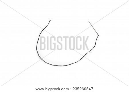 Black Thread In A Needle On A White Background, Isolate