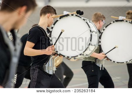 Musicians March, Play And Make Music With Large Bass Drums