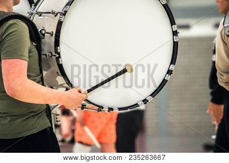 Musicians March, Play And Make Music With Large Bass Drums