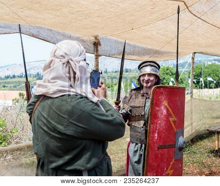 Goren, Israel, April 06, 2018 : A Visitor To A Knight Festival Poses For A Photographer In The Form 