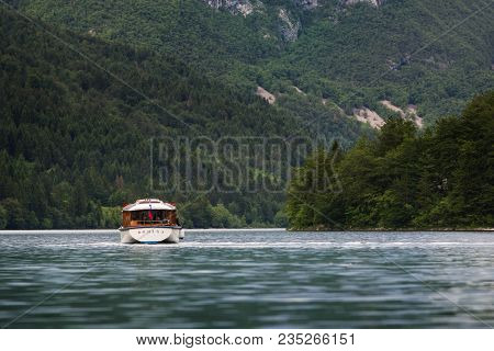 Slovenia, Bohinj Lake, Triglav National Park, Juni 2016: The Touristic Boat On The Lake Bohinj. Hill