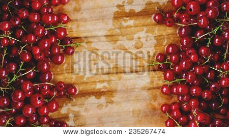 Background: Red Currant On Wooden Cutting Board. Summer Atmosphere.