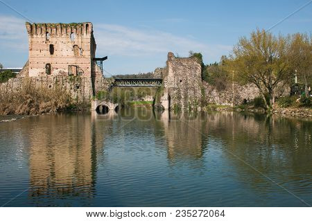 The Famous Visconteo Bridge On The Borghetto Sul Mincio Medieval Village, Italy