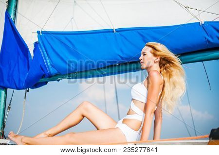Woman Sitting On Sail Boat Or Yacht