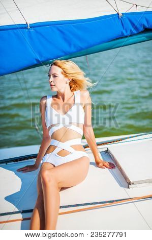 Woman Sitting On Sail Boat Or Yacht