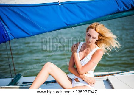Woman Sitting On Sail Boat Or Yacht
