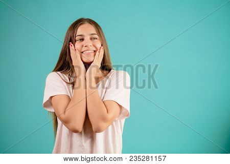 Cheerful Likeable Young Woman In White T-shirt With Happy Dreaming Look
